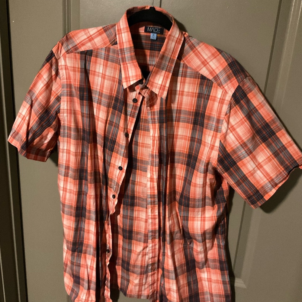 Orange and blue short sleeve button go! Cam Newton’s brand!